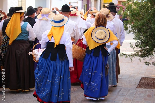 Locals in traditional dresses at a public Canarian festival (La Gomera, Spain) photo