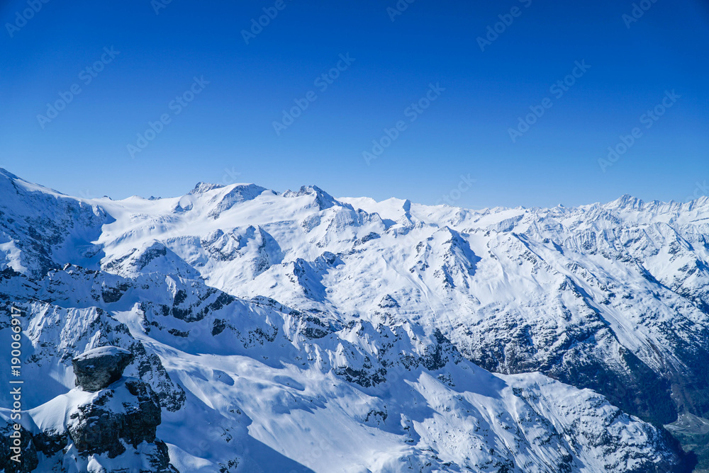 landscape big mountains snow covered blue sky background