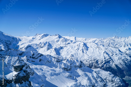 landscape big mountains snow covered blue sky background © jo1000du
