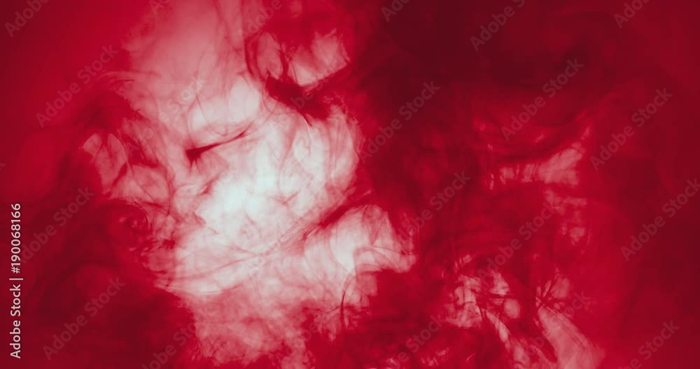 red paint floating in water like smoke cloud