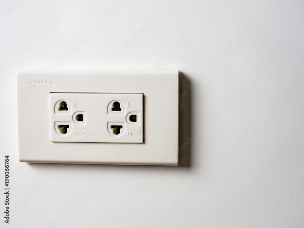 White socket 220 volts on white wall, unplugged White socket 220 volts on white wall, unplugged