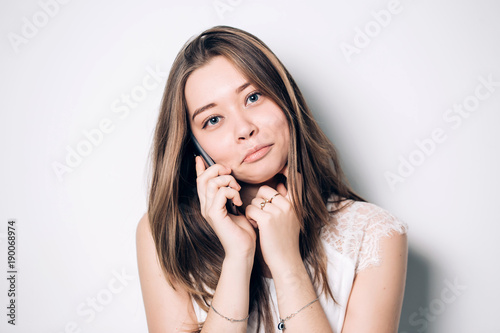 Young Beautiful Woman Talking On Mobile Phone.
