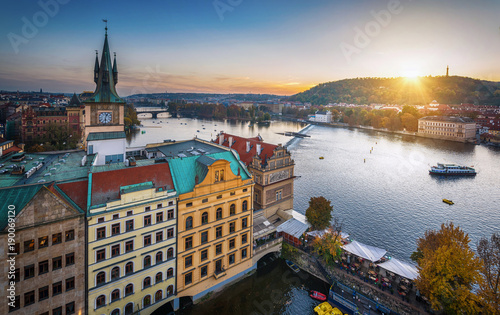 Evening in Prague. View of the roofs of houses and the river Vltava. Czech Republic.