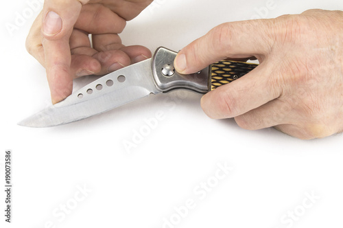 Pocket folding knife on the white background