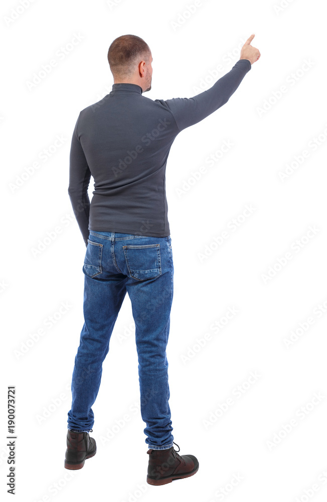 Back view of pointing young men in shirt and jeans. Back view of pointing young men in shirt and jeans.