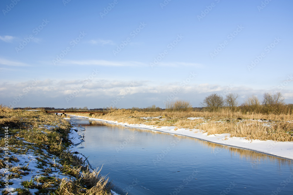 Winter landscape of river and sky