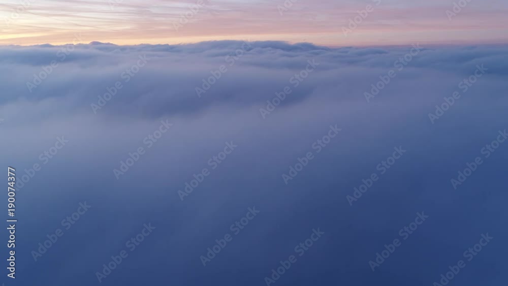 Drone flight above moving cloudscape with beautiful sun rays Drone flight above moving cloudscape with beautiful sun rays