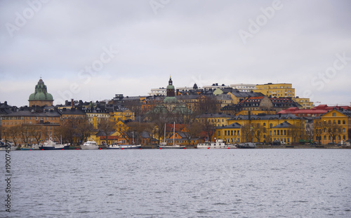 Old houses and boats at Norr Malarstrand i Stockholm a grey winter day