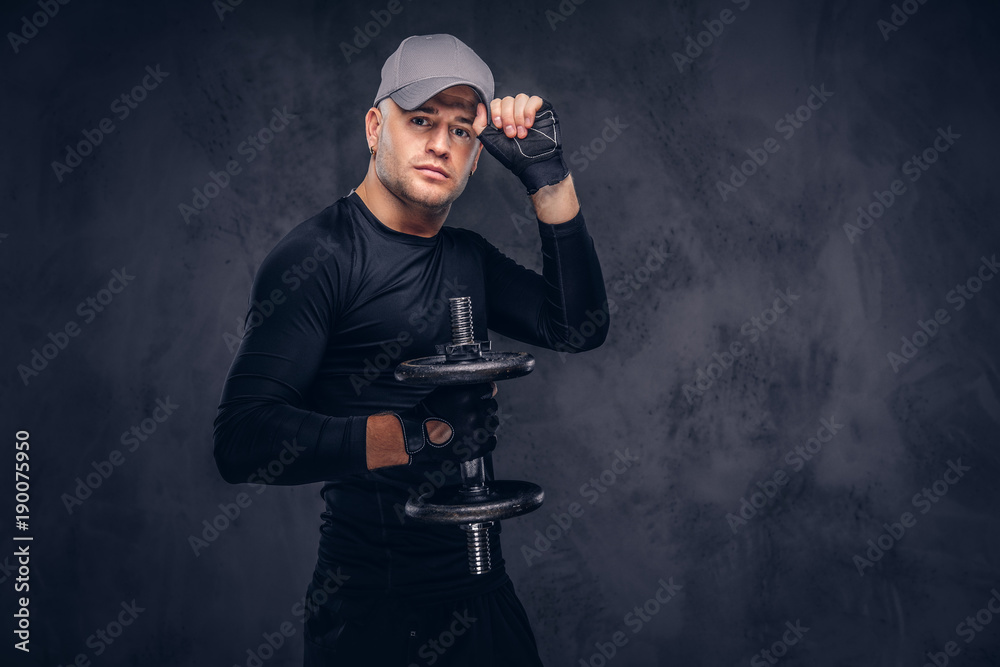 A handsome man, dressed in a black sportswear. A handsome man, dressed in a black sportswear.