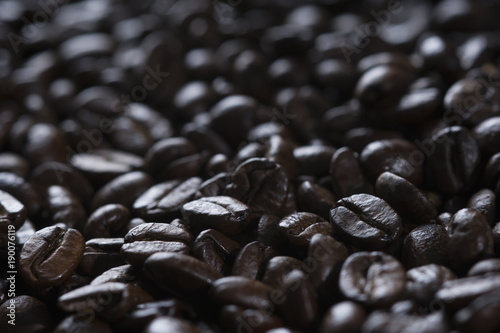 some roasted coffee beans photographed with backlight