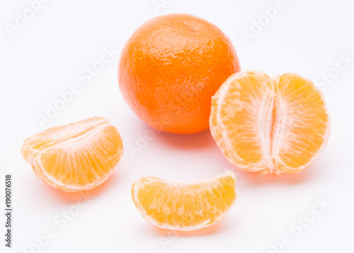 Whole and half of mandarin oranges isolated on white background