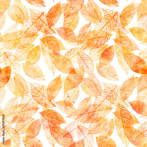 Seamless background pattern of golden tinted watercolor leaves