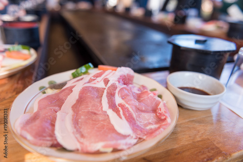 Pork set on dish and hot pan background