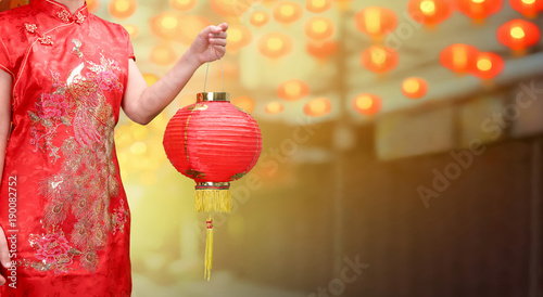 woman holding chinese new year lanterns in china town