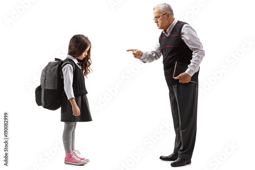 Obraz na plátně Old teacher scolding a schoolgirl