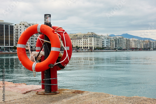 Lifebuoys on quay in Thessaloniki photo