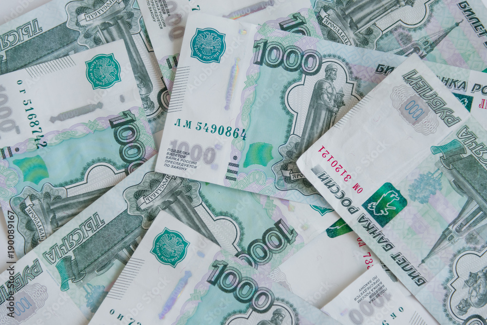Obraz premium Money in Russia. Banknotes one thousand rubles, background, selective focus
