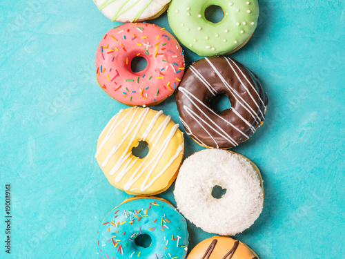 donuts on blue background, top view