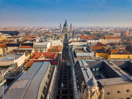 Budapest  Hungary - Aerial skyline view of famous St.Stephen s Basilica and the skyline of Budapest at sunset with blue sky