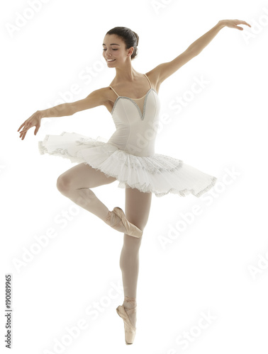 Fotografie, Obraz ballerina with white tutu doing the pique pose on white background