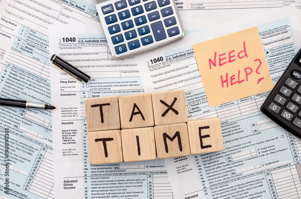 tax form with wooden cubes, sticker, pen and calculator Stock Photo ...