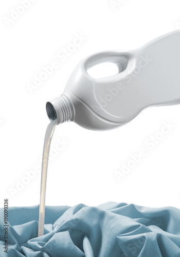 detergent pouring on blue cloth on white background