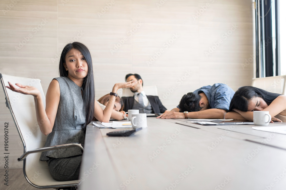 Fototapeta premium In selective focus of Business people sleeping in the conference room during a meeting. Setup studio shooting.