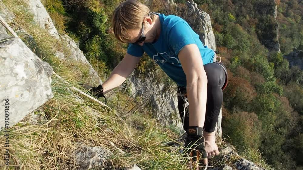 Highlining climber on mountain in Belgium for extreme sports