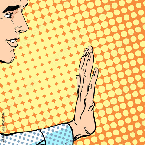 Man with hand up to stop. Stop hand. Prohibiting signal. Stop signal.