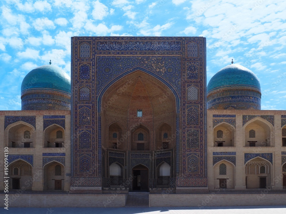 Mir-i-Arab Mosque: entrance door and walls in cyan, blue and turquoise mosaics