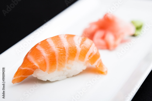 Salmon sushi served on a plate