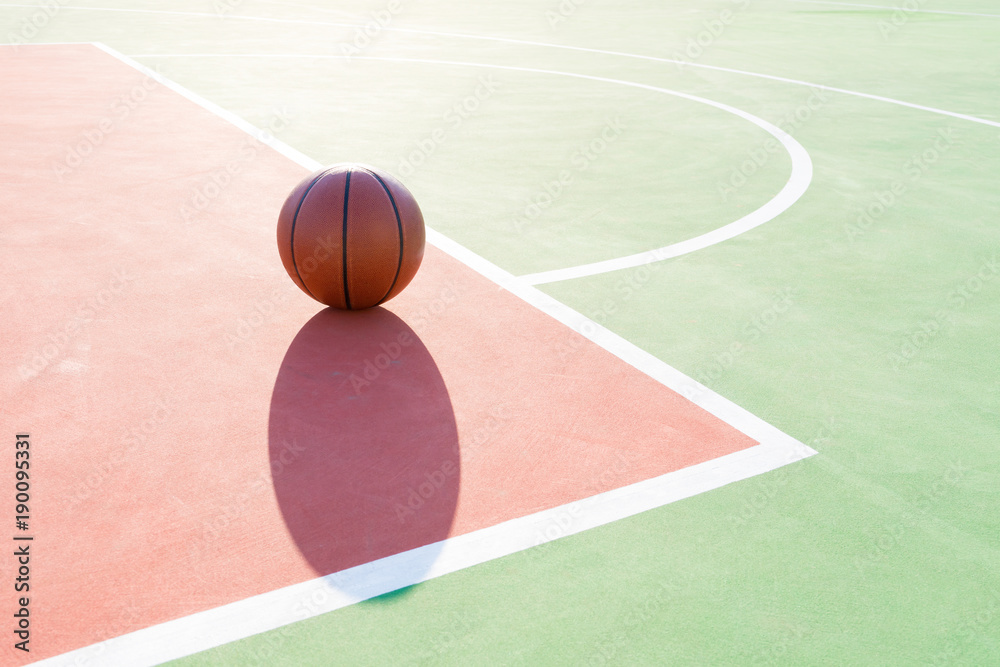 basketball on the playing field in a day time against the Sun basketball on the playing field in a day time against the Sun