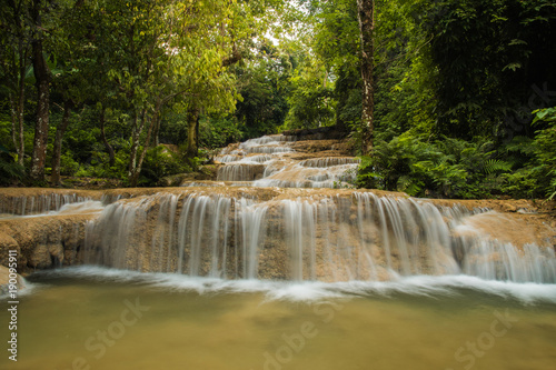 soft water of the stream in the natural park, Beautiful waterfall in rain forest © aedkafl