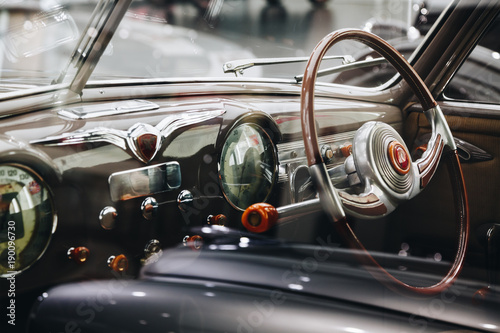 Interior vintage car with steering wheel and dashboard © Alessandro