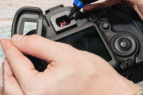 Wallpaper Mural Digital camera dust cleaning service concept Torontodigital.ca