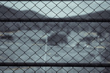 Steel nets or mesh with blurry mountain background for web site
