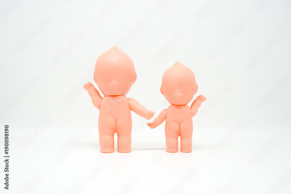 Couple of cute naked dolls on white isolated background.