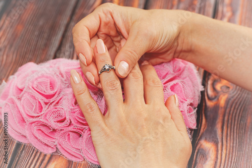 Wallpaper Mural Woman puts on silver ring. romantic concept Torontodigital.ca