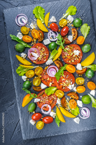 Vegetarian salad, decorative served on natural slate board.