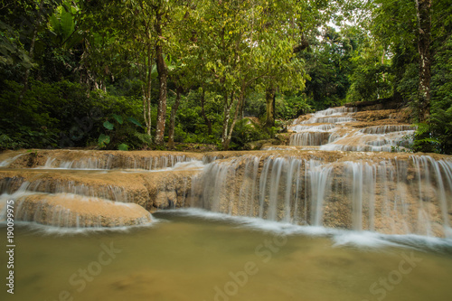 Fototapeta Naklejka Na Ścianę i Meble -  soft water of the stream in the natural park, Beautiful waterfall in rain forest