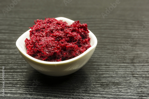 A bowl of grated beetroot with horseradish.