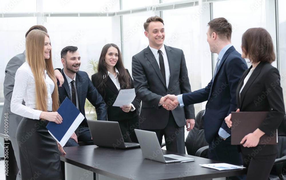 handshake business partners at a meeting in the office handshake business partners at a meeting in the office