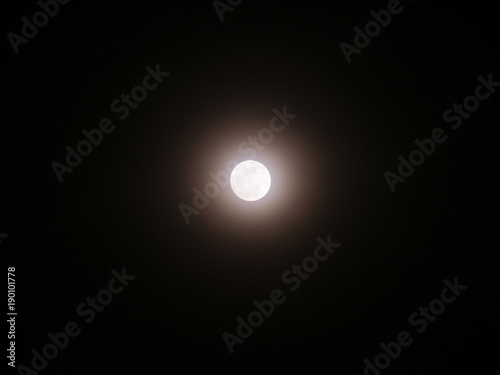 Moon Emitting Light with Halo