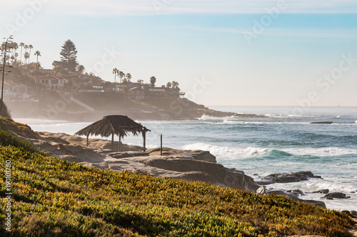 Hazy morning on Windansea Beach in La Jolla, California with iconic surfer shack.
