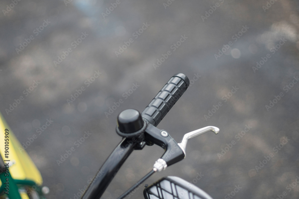 Handlebars of bicycle parked on street Handlebars of bicycle parked on street