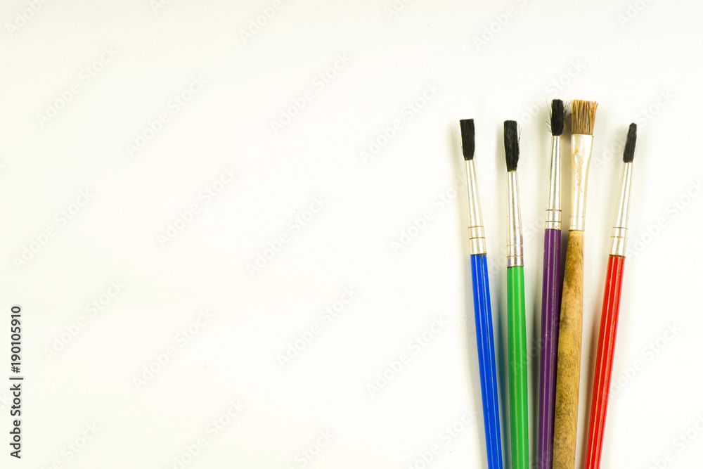 Concept of painting, brushes on a white background Concept of painting, brushes on a white background