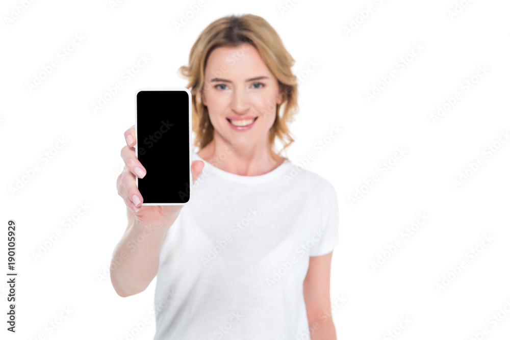 portrait of smiling woman showing smartphone with blank screen isolated on white portrait of smiling woman showing smartphone with blank screen isolated on white