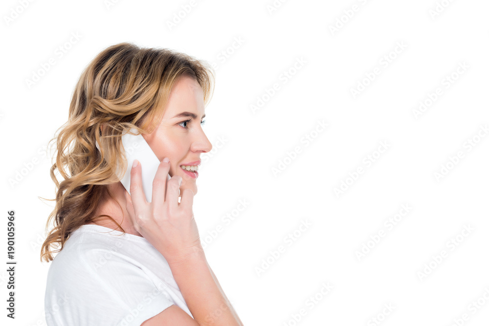 side view of smiling woman talking on smartphone isolated on white side view of smiling woman talking on smartphone isolated on white