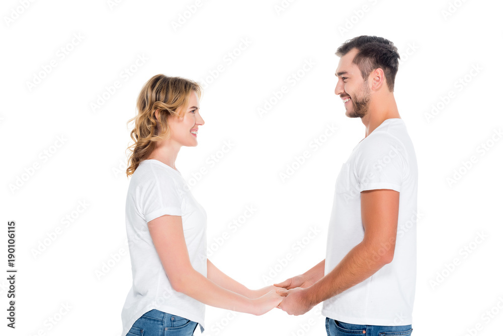 happy couple holding hands, isolated on white happy couple holding hands, isolated on white