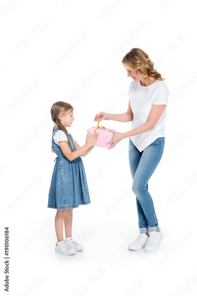 mother and daughter with gift box, isolated on white mother and daughter with gift box, isolated on white